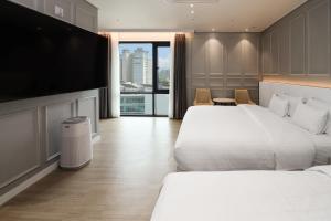 Postel nebo postele na pokoji v ubytování Hound Hotel Mokpo Peace Plaza + 69 fotografií