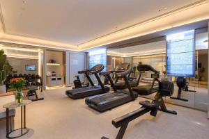 a gym with a bunch of exercise bikes in it at Mercure Taiyuan City Centre in Taiyuan