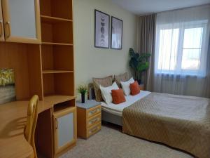 Ένα ή περισσότερα κρεβάτια σε δωμάτιο στο Звёздный Оазис