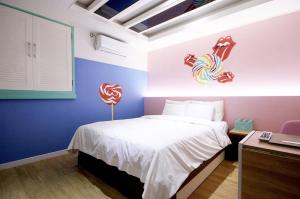 En eller flere senge i et værelse på Jeonju Jawoori Hotel