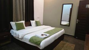 Ένα ή περισσότερα κρεβάτια σε δωμάτιο στο Amaya hotel