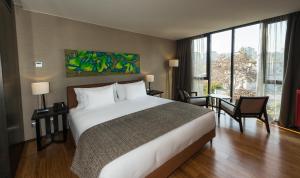 Postel nebo postele na pokoji v ubytování Ladera Boutique Hotel