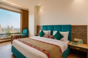 Ένα ή περισσότερα κρεβάτια σε δωμάτιο στο The Continental Square Amritsar !! Near Bus stand ! Parking ! Near Golden Temple