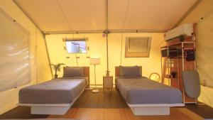 Postel nebo postele na pokoji v ubytování Hilir Hening