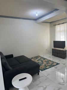 Khu vực ghế ngồi tại Crane Beach Newley Built Condo Steps From Beach