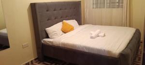 Postel nebo postele na pokoji v ubytování cozyhub