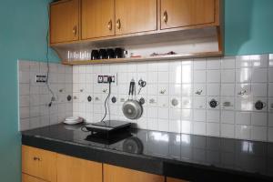 a kitchen with a sink and a counter top at Guler House in Jāmb