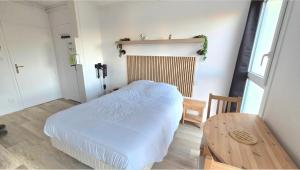 Ένα ή περισσότερα κρεβάτια σε δωμάτιο στο Studio Cosy 1pers