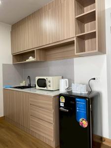 Kuchyň nebo kuchyňský kout v ubytování Chorbnorn Hotel