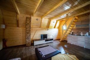 a large room with wooden walls and wooden floors at Una Relax in Vajagići