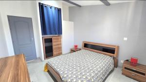 a bedroom with a bed and a large window at Résidence La Clé des Champs in Clam +29 photos