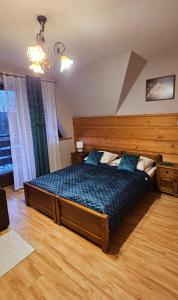 En eller flere senge i et værelse på Maria Chyc wynajem pokoi gościnnych
