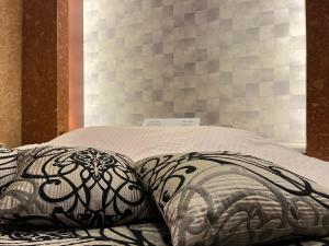 Postel nebo postele na pokoji v ubytování SKY Windy Adult Only Love Hotel