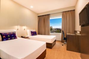 Postel nebo postele na pokoji v ubytování Keys Select by Lemon Tree Hotels, Whitefield, Bengaluru + 76 fotografií