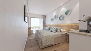 a bedroom with a bed in a room at Hotel Moré in Alcudia