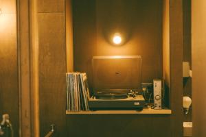 a small computer on a shelf in a bathroom at ONYO Hotel and Lounge in Ueda +42 photos