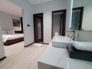 Ένα ή περισσότερα κρεβάτια σε δωμάτιο στο Toàn Cầu Villa