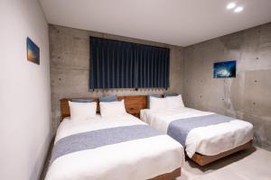 Postel nebo postele na pokoji v ubytování Emerald Ocean Villa