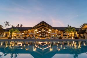 a view of a resort with a swimming pool at Cebu Beach Club in Argao