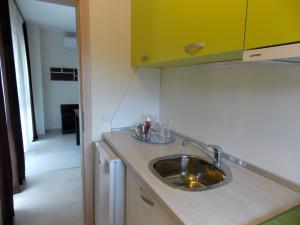 A kitchen or kitchenette at Apart Hotel Rosen