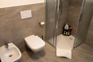 a bathroom with a shower and a toilet and a sink at Casa da Normi in Valdisotto +20 photos
