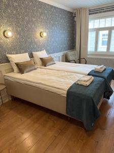 Postel nebo postele na pokoji v ubytování Finlandia Hotel Puu-Juuka