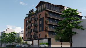 a tall building with cars parked in front of it at S by Z Hotels, HSR in Bengaluru