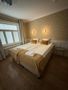 Postel nebo postele na pokoji v ubytování Finlandia Hotel Puu-Juuka