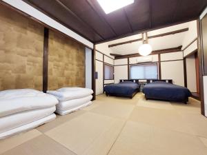 En eller flere senge i et værelse på Ebisunoan