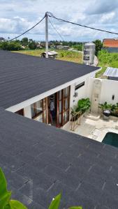 a view of a house with a roof at Villa in the Heart of Pererenan Prime Location in Munggu