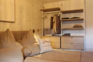 a living room with a couch and a closet at Apartment Bergliebe in Oberammergau