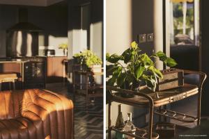 a living room with a couch and a table with a plant at Villa 1493 in Gustavia