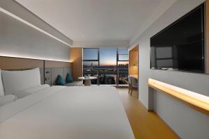 TV a/nebo společenská místnost v ubytování JI Hotel Chongqing Shangqing Temple Niujiaotuo Subway Station