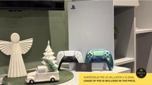 a display with consoles and a toy car and a christmas tree at KRUNA 406 Apartment in Becici