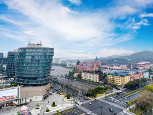 a view of a city with buildings and a street at Orange Hotel Hangzhou Songcheng in Hangzhou