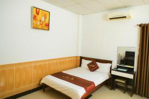 Ένα ή περισσότερα κρεβάτια σε δωμάτιο στο Trúc Hoàng Hà Hotel +52 φωτογραφίες