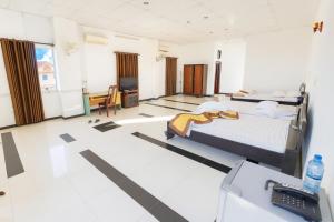 Ένα ή περισσότερα κρεβάτια σε δωμάτιο στο Trúc Hoàng Hà Hotel