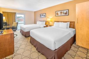 Ένα ή περισσότερα κρεβάτια σε δωμάτιο στο Comfort Inn