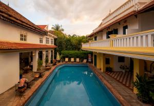 a swimming pool in a courtyard of a building at Residence Wat Damnak in Siem Reap
