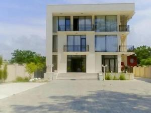 a large white building with a lot of windows at Belgrad Rustaveli Kobuleti in K'obulet'i