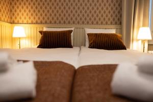 Postel nebo postele na pokoji v ubytování Finlandia Hotel Puu-Juuka + 5 fotografií