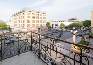 a view of a city street from a balcony at Art Passage Hotel in Baku