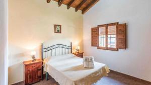 En eller flere senge i et værelse på Casa El Cerro El Borge by Ruralidays + 27 billeder