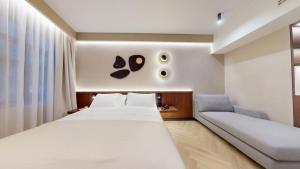 Postel nebo postele na pokoji v ubytování Hotel Trianon