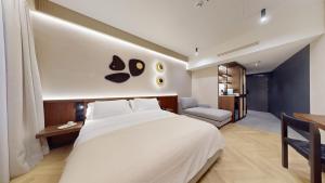 Postel nebo postele na pokoji v ubytování Hotel Trianon