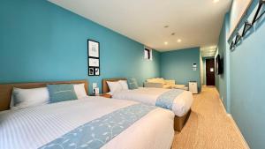 Postel nebo postele na pokoji v ubytování FUKUOKA MOJIKO STAY