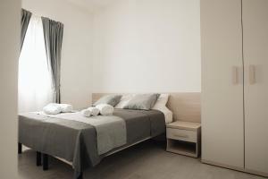 Ένα ή περισσότερα κρεβάτια σε δωμάτιο στο Casa del Sole