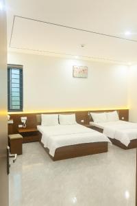 Postel nebo postele na pokoji v ubytování Visip 2 Hotel