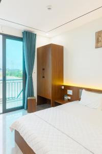 Postel nebo postele na pokoji v ubytování Visip 2 Hotel