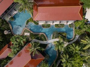 an aerial view of a resort pool with palm trees at Anantara Hua Hin Resort in Hua Hin